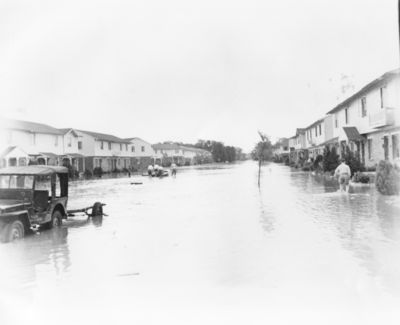 Flooded Street Scene at Carswell 1949
Flooded street scene at Carswell Air Force Base during the flood of the Clear Fork of the Trinity river in 1949. There is a jeep in the water in the foreground and a men pushing a boat in the middle of the picture.

Flooded Street Scene at Carswell, Photograph, n.d.; digital image, (http://texashistory.unt.edu/ark:/67531/metapth27976/ : accessed June 19, 2013), University of North Texas Libraries, The Portal to Texas History, http://texashistory.unt.edu; crediting Tarrant County College NE, Heritage Room, Fort Worth, Texas.

