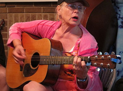 Music Night at the home of Jeff Gibbons on Harrison Avenue, July 4, 2013
Barbara Taylor at the guitar. Photo by Jim Peipert

